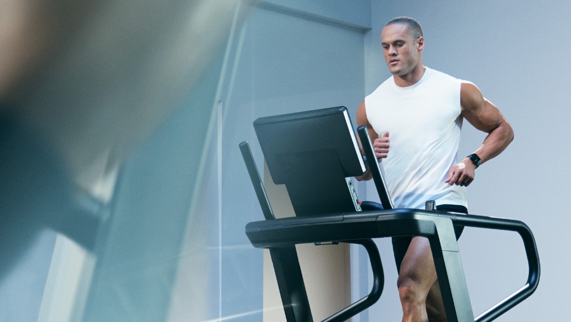 Person running on a treadmill in the UltraFit boutique group training class